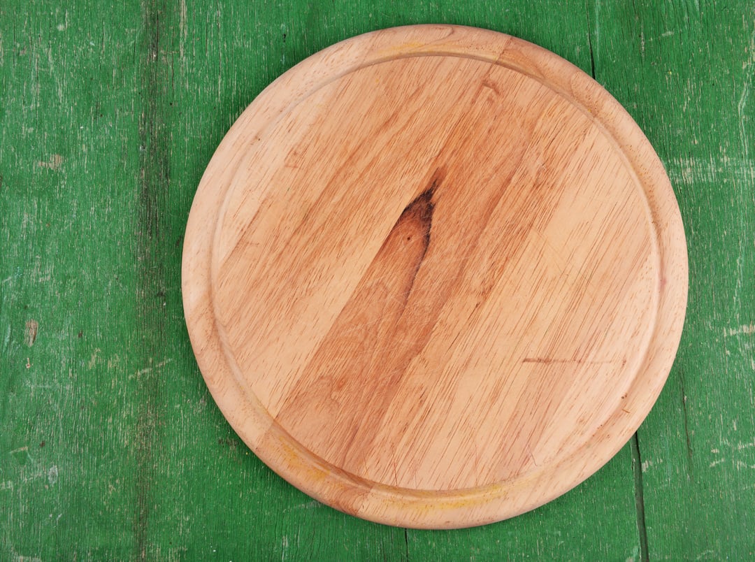 Empty Cutting Board on Wooden Background