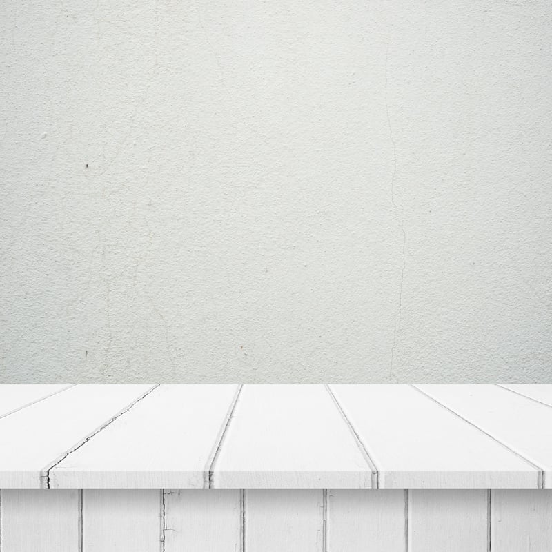 Empty Light Wooden Table on Concrete Wall Background